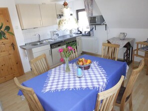 Enjoy meals in this cozy dining area with a microwave and kettle at hand.