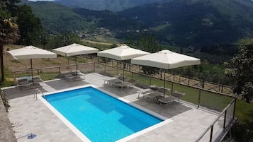Relax by the pool surrounded by a serene mountain view.