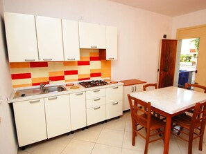 Apartment | Private kitchen - Sun Drenched Seaside Holiday Home near Venice (Rosolina)