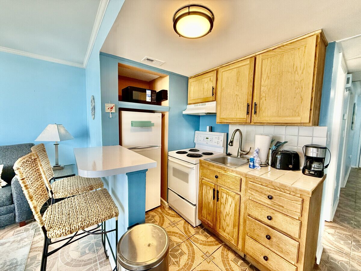 Fridge, microwave, stovetop, coffee/tea maker