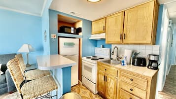 Fridge, microwave, stovetop, coffee/tea maker