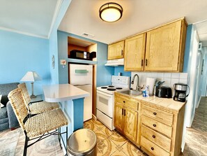 Fridge, microwave, stovetop, coffee/tea maker