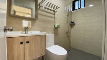 Shower, hair dryer, slippers, towels