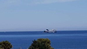 A large cruise ship named "CRYSTAL GLITZ" on the ocean. - Hotel Citrus (Ksamil)