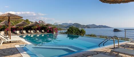 Seasonal outdoor pool, pool umbrellas, pool loungers