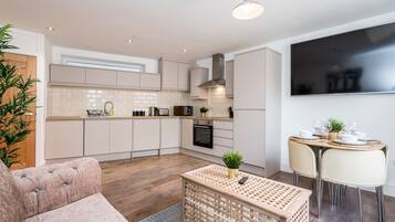Apartment, 1 Bedroom | Living area | 50-inch Smart TV with digital channels, TV, Netflix