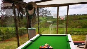 A pool table with balls on a white table in a room with large windows. - vacation home   (Hugleville-en-Caux)