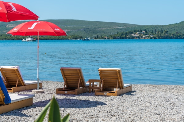 Private beach, sun loungers, beach umbrellas, beach towels