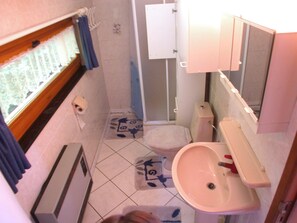 A compact bathroom with a toilet, sink, and shower. - Comfortable Chalet in Petithan With Garden (Durbuy)