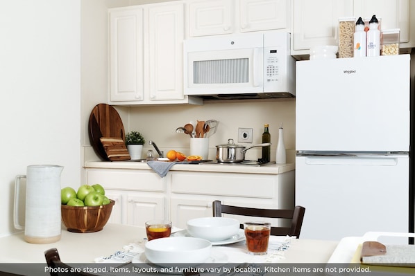 Full-size fridge, microwave, stovetop, freezer