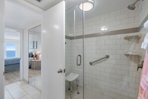 Bathtub, hair dryer, towels, soap