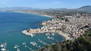 A coastal cityscape with a marina, historic buildings, and a mountainous backdrop. - Beautiful Detached Villa With Private Pool Surrounded by Hills and Nature (Castellammare del Golfo)