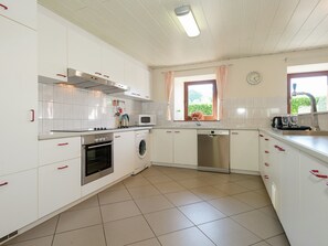 Cottage | Private kitchen | Microwave, dishwasher, coffee/tea maker, highchair