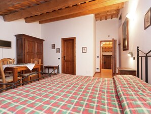 Cozy bedroom with a large bed, bedside tables, and a wardrobe, perfect for a restful stay.