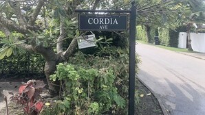 A street sign for Cordia Ave with a small sign underneath indicating a private property. - West Coast 1 Bedroom Apartment - Close to beach (66) (Holetown)