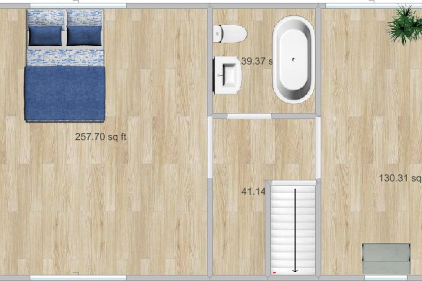 A room layout with a bed, a bathroom, and a small seating area.