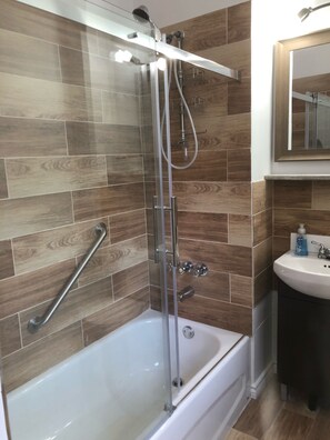 Combined shower/tub, hair dryer, towels, toilet paper