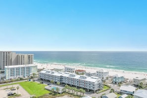 A beachfront hotel with multiple buildings, a pool, and a beach view. - Seascape 210- CONVENIENT LOCATION, FUN FOR THE WHOLE FAMILY (Orange Beach)