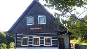 A wooden building with a sloped roof and a sign that reads "panorama". - Luxury Chalet in Stupna near Ski Area (Vidochov)