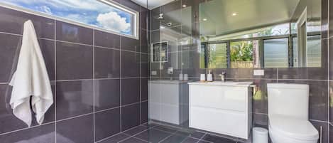 Bathtub, hair dryer, towels, soap