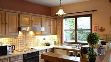 Villa | Private kitchen | Fridge, high chair