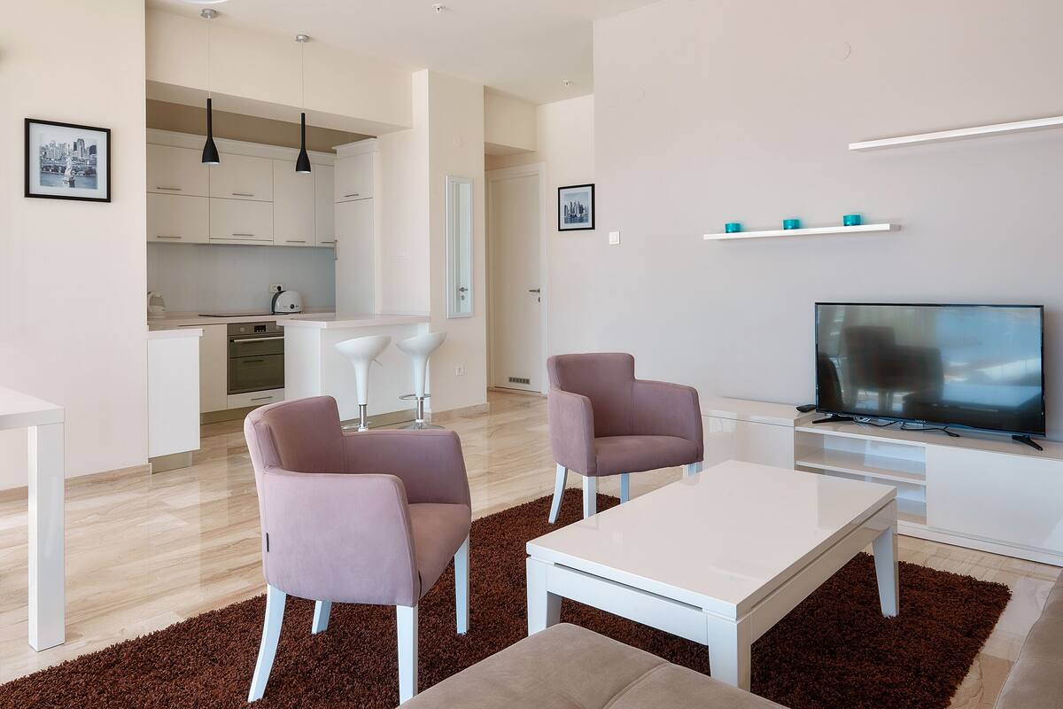 Family Suite, 2 Bedrooms, Sea View | Living area | Flat-screen TV