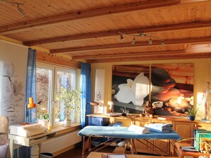 Relax in this serene space with a massage table and calming views through the large window.