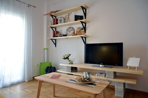 Lägenhet City | Vardagsrum | 40-tums platt-tv med digitalkanaler och LCD-tv