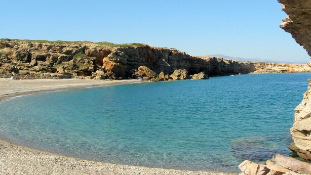 A coastal landscape with rocky cliffs and clear blue waters. - Stylish Villa in Loutra with Private Pool & Garden near Sea Beach (Rethymno)