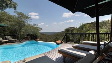 Outdoor pool, pool umbrellas, pool loungers