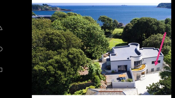 A modern house with a curved roof, surrounded by lush greenery and a view of the sea. - The Mount,  2 ensuite double rooms by The Royal William Yard (Plymouth)