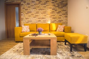 Apartamento exclusivo | Zona de estar | Una televisión de pantalla plana