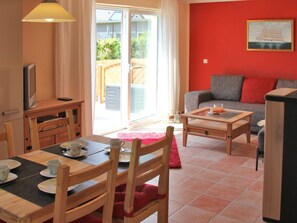 House | Living room | Fireplace, DVD player - Spacious Cottage in Börgerende Germany near Baltic Sea Beach (Boergerende-Rethwisch)