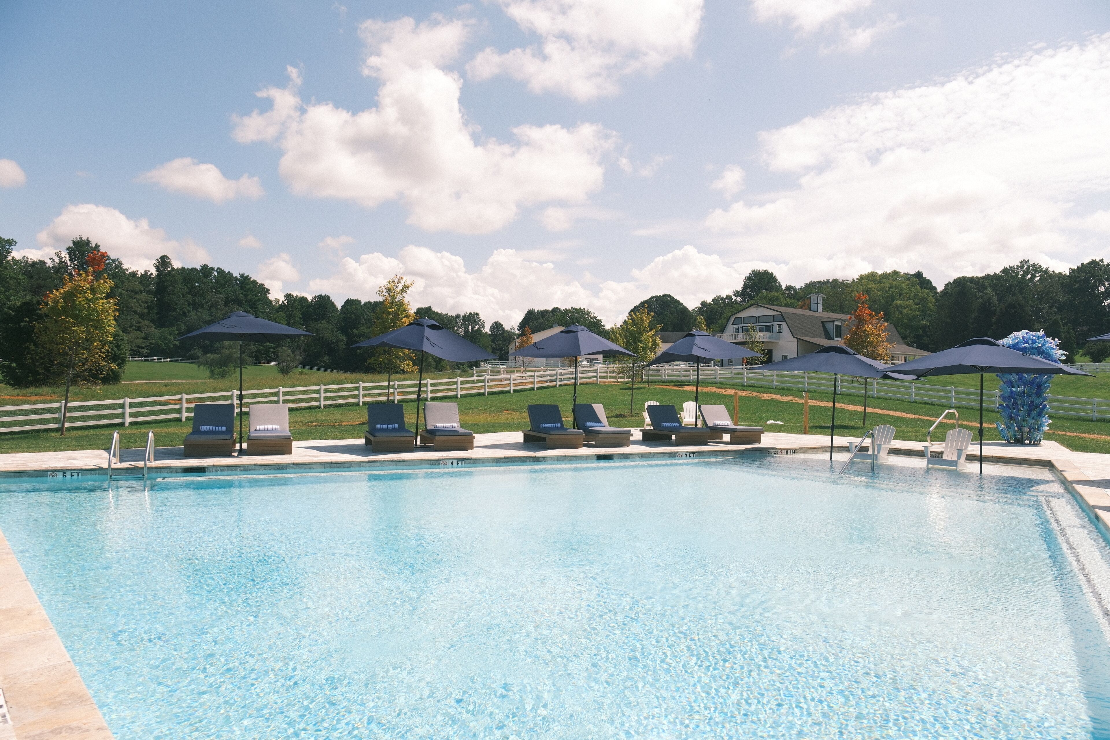 Outdoor pool, open 7:00 AM to 9:00 PM, pool umbrellas, pool loungers