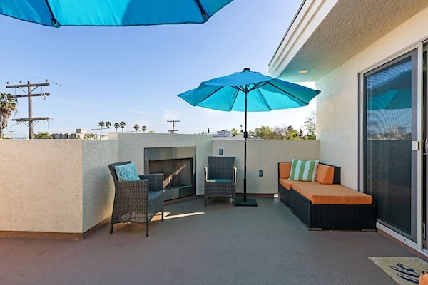 Roof Top deck with brand new outdoor cushions and fireplace for a cozy evening