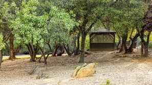A gazebo surrounded by trees in a park setting. - Angels Camp | Friends & Family Golf Getaway | Pool + Golf | 3BR Sleeps 8 (Angels Camp)