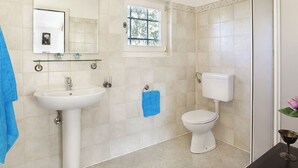 A bathroom with a sink, mirror, toilet, and window. - Holiday Home with Swimming Pool near Lim Bay & Beach (Vrsar)