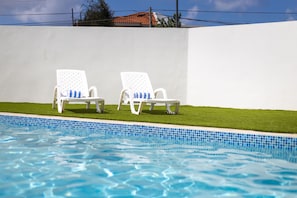Outdoor pool, pool umbrellas, sun loungers