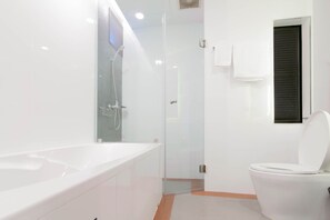 Bathtub, hair dryer, towels, soap