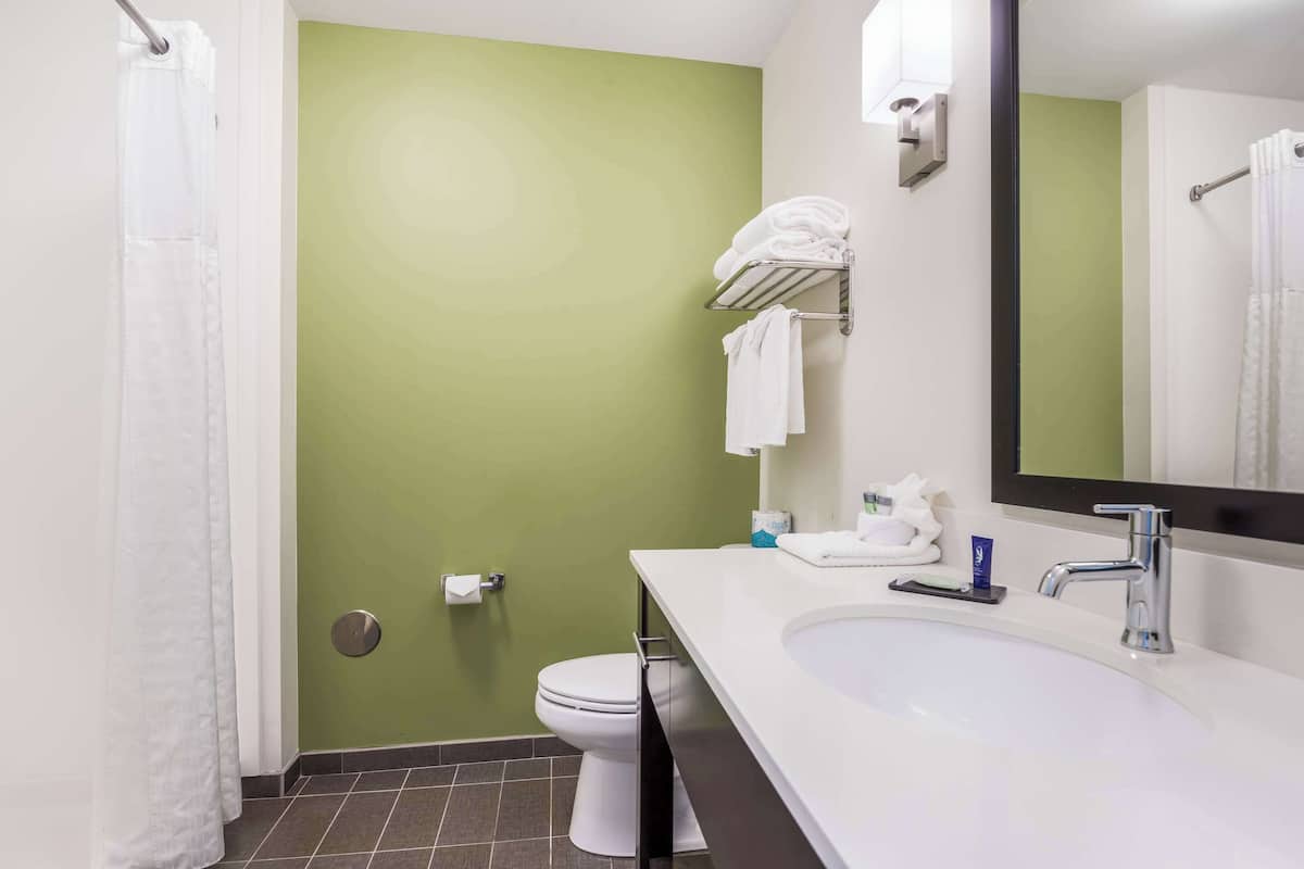 premium bedding, desk, blackout curtains, iron/ironing board