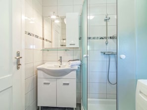 Villa | Bathroom | Bathtub, hair dryer, towels