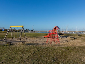 Enjoy a fun-filled day at our beachside playground with a swing set and climbing structure.