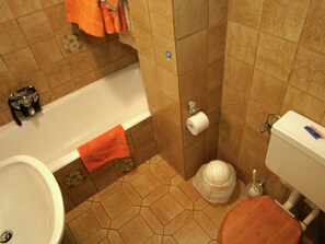 Kombinasi shower/bathtub dan handuk