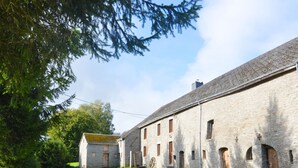 A stone building with a gravel path leading to a grassy area. - Peaceful Holiday Home With Garden in Fauvillers Belgium (Fauvillers)