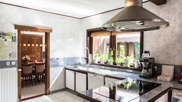 Villa | Private kitchen | Microwave, stovetop, dishwasher, highchair