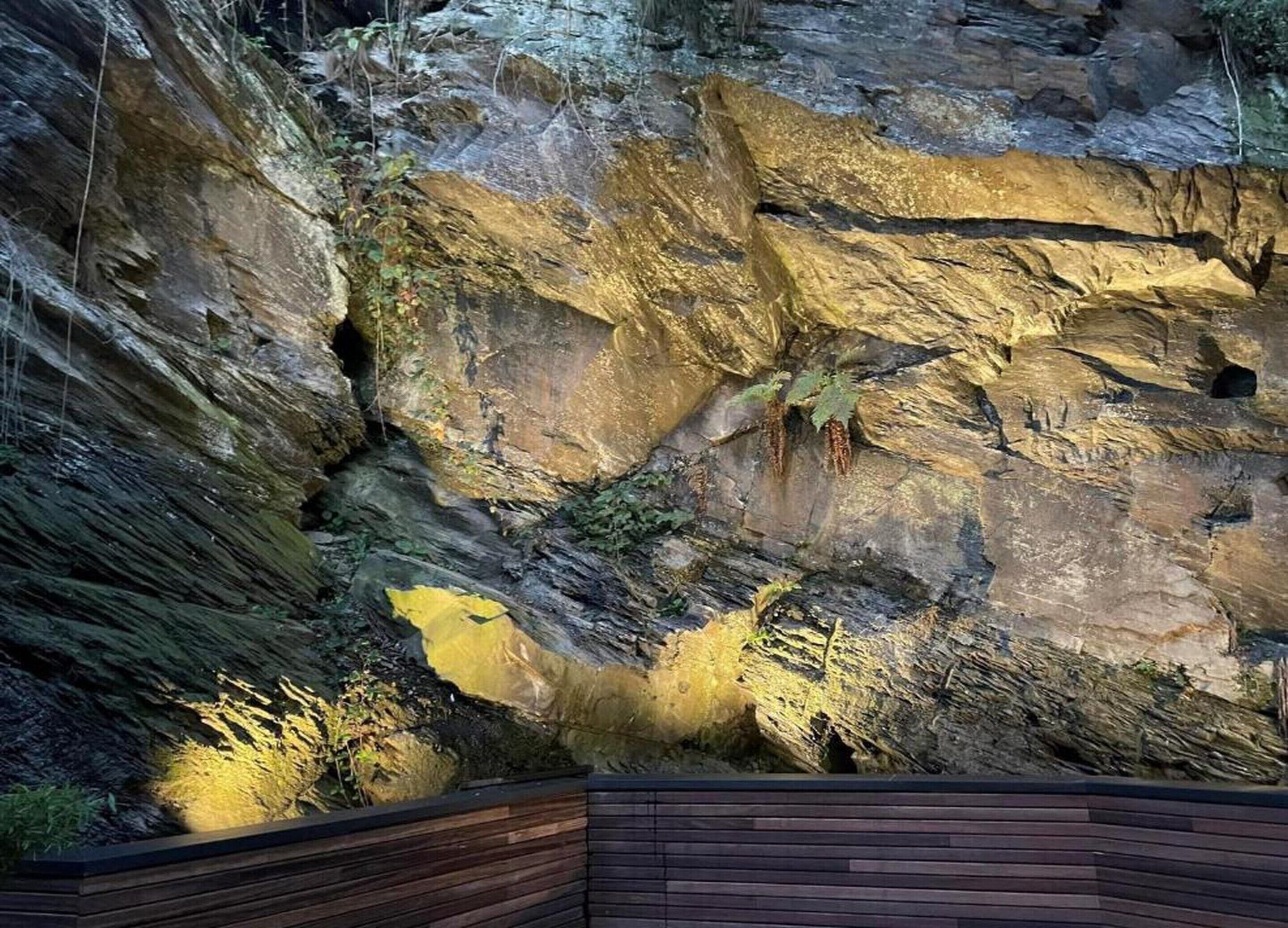 A rocky landscape with a wooden viewing platform.