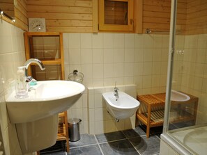A bathroom with a sink, bidet, and shower. - Spacious Chalet Located at Bomal with Hot Tub & Garden Parlour (Durbuy)