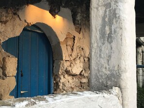 Step through the historic stone archway to a charming entrance.