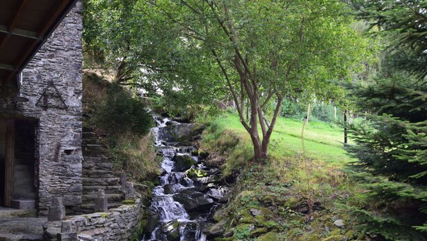 A stone building with a small waterfall and steps leading up to it. - Renovated Mill in Bastogne Near Waterfall (Bastogne)