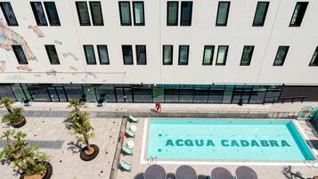 Seasonal outdoor pool, pool umbrellas, pool loungers